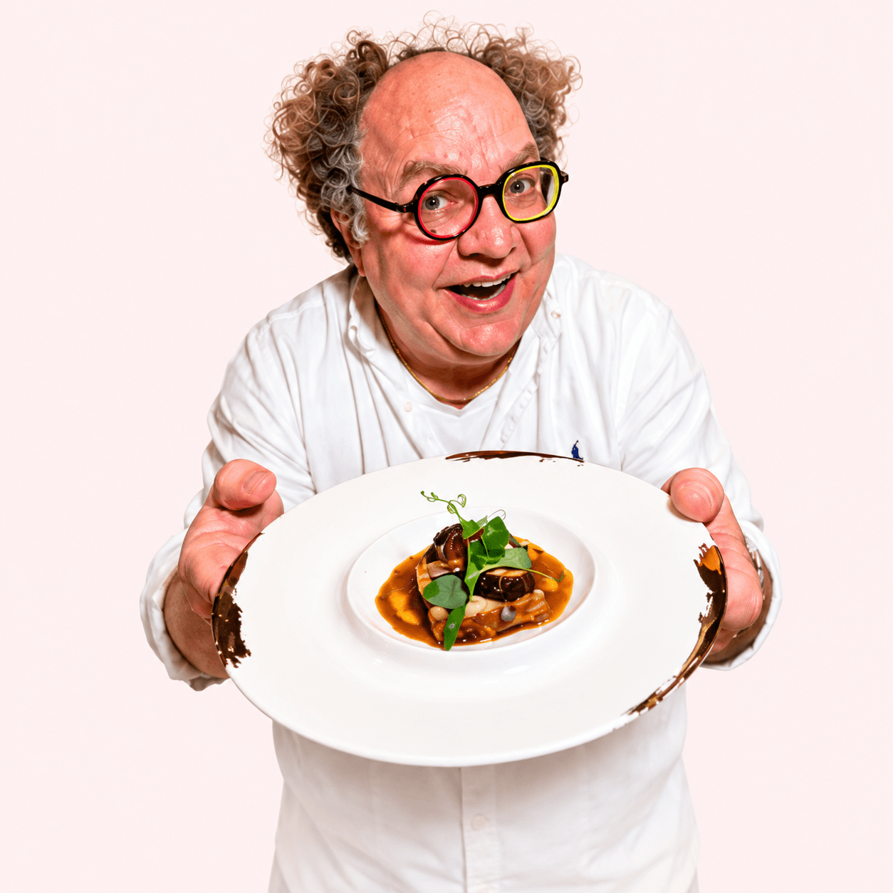 Mr Taster, Hubert Sepidnam, presenting a dish with his signature colourful glasses